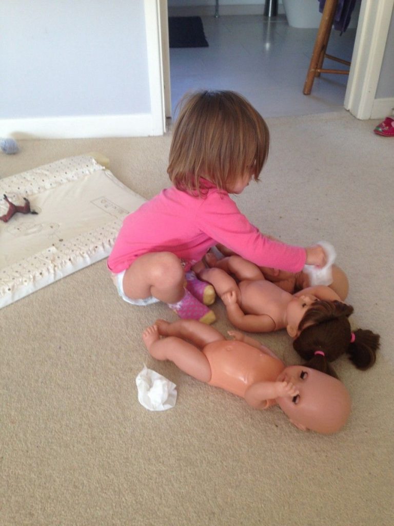 Playing with dolls